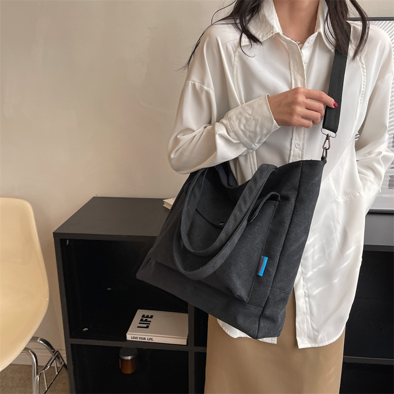 Los fabricantes venden al por mayor el nuevo bolso Tote para mujer bolso de lona de color sólido de gran capacidad bolso de mensajero de hombro casual de moda simple