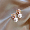Zirconium with bow, shiny earrings from pearl, micro incrustation