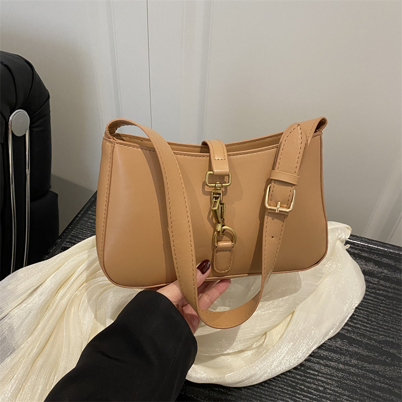 Textura de la bolsa de hombro de la mujer de la primavera de 2025 nueva bolsa de mochila en el temperamento elegante bolso cuadrado