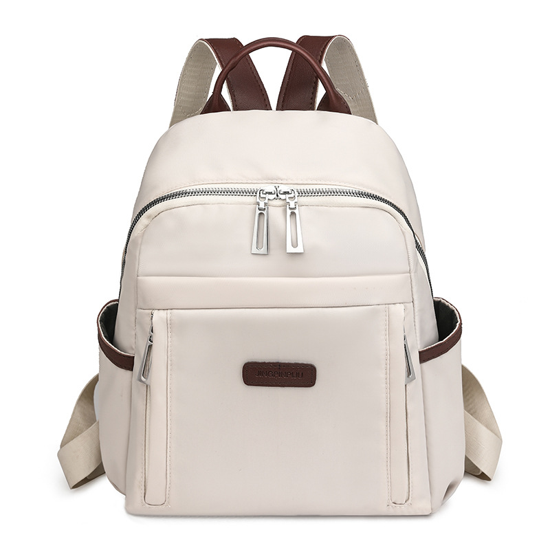 Venta al por mayor transfronteriza 2024 invierno nuevo estilo casual damas mochila de nailon simple y versátil mochila de viaje ligera marea