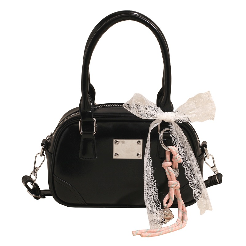Bolsa de bolos portátil coreana de nicho para mujeres 2026 nueva textura mochila de hombro de estilo extranjero para viajar simple