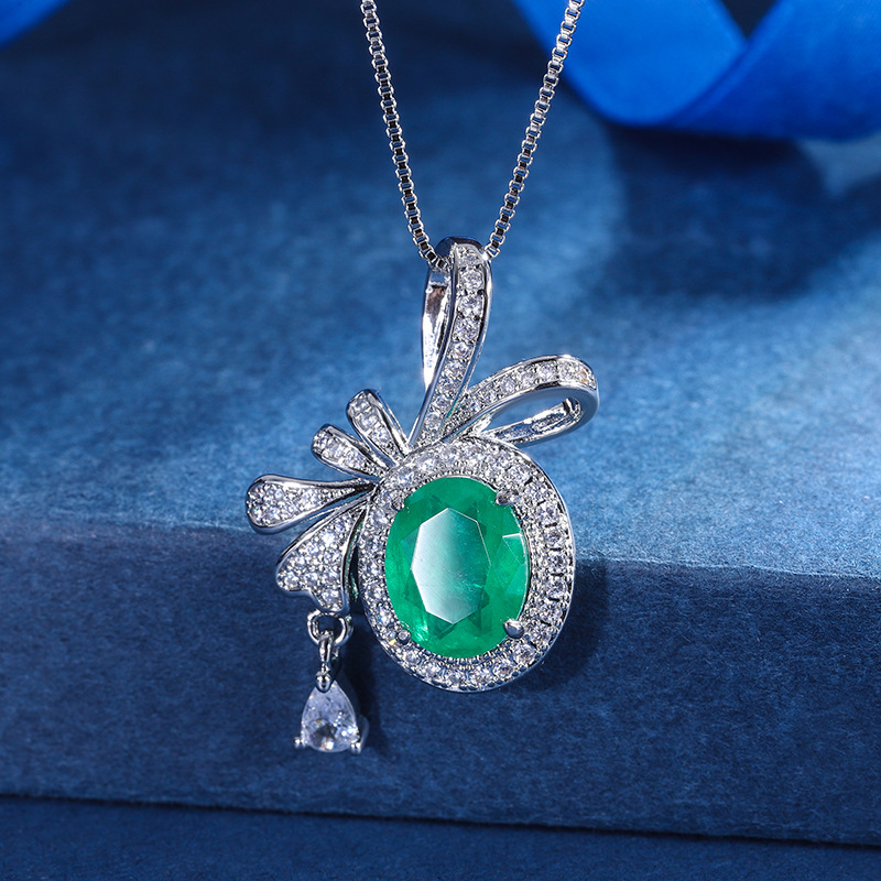 Zhuang Sheng joyas cobre inferior chapado en oro Nueva simulación color tesoro arco creativo colgante collar diamante incrustado piedra principal 8 *