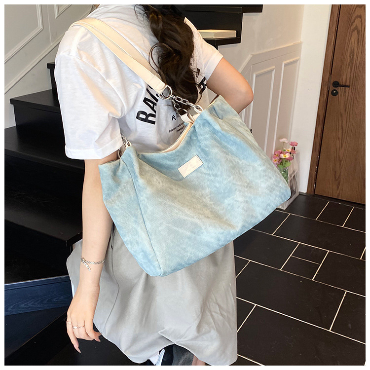 Korean style simple and versatile bag for women, new summer 2025 fashion and niche handbag, large capacity tote bag for commuting undefined
