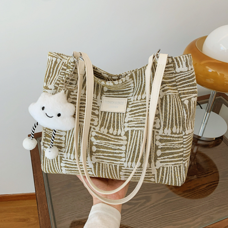 Bolsa multipropósito coreana de hombro de mujer, nicho de diseño de textura portátil, bolso de hombro de mujer, pequeño bolso fresco.