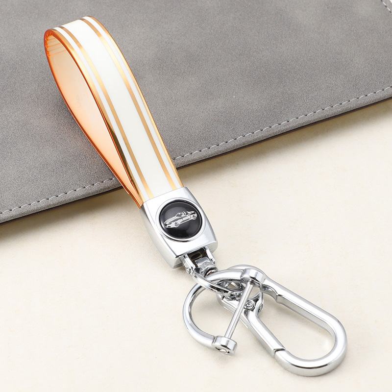 Cuerda de mano de silicona transfronteriza llavero de coche logotipo de coche apellido llavero anti-pérdida llavero de cuerda de mano de silicona duradera