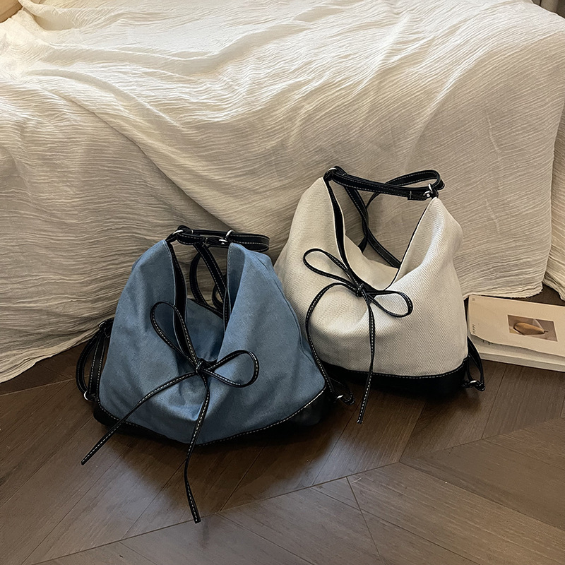 Bolsa de lona de nicho coreana para mujeres 2024 nueva moda de transporte de doble uso mochila de hombro universal