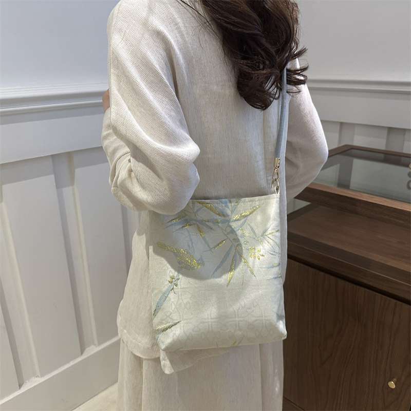 New Guofeng Jacquard canvas bolsas para mujeres 2024 verano nuevo popular bolso de hombro universal para viajar bolsas de cubo debajo de las axilas