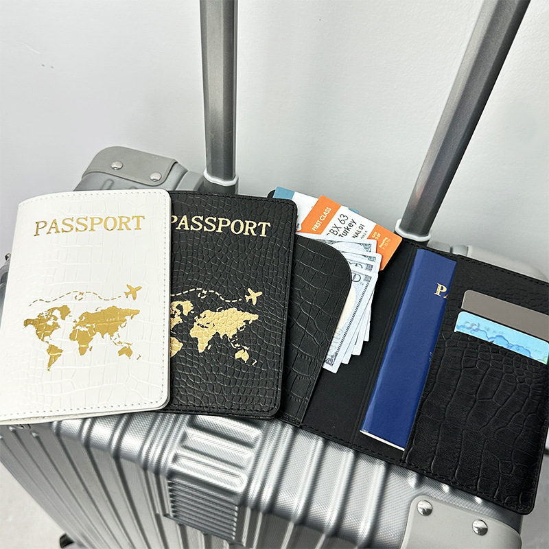 Spot Cross-border PU cuero patrón de cocodrilo protección de pasaporte este conjunto de clip de pasaporte de cuero estampado en caliente mapa bolsa de pasaporte en blanco y negro