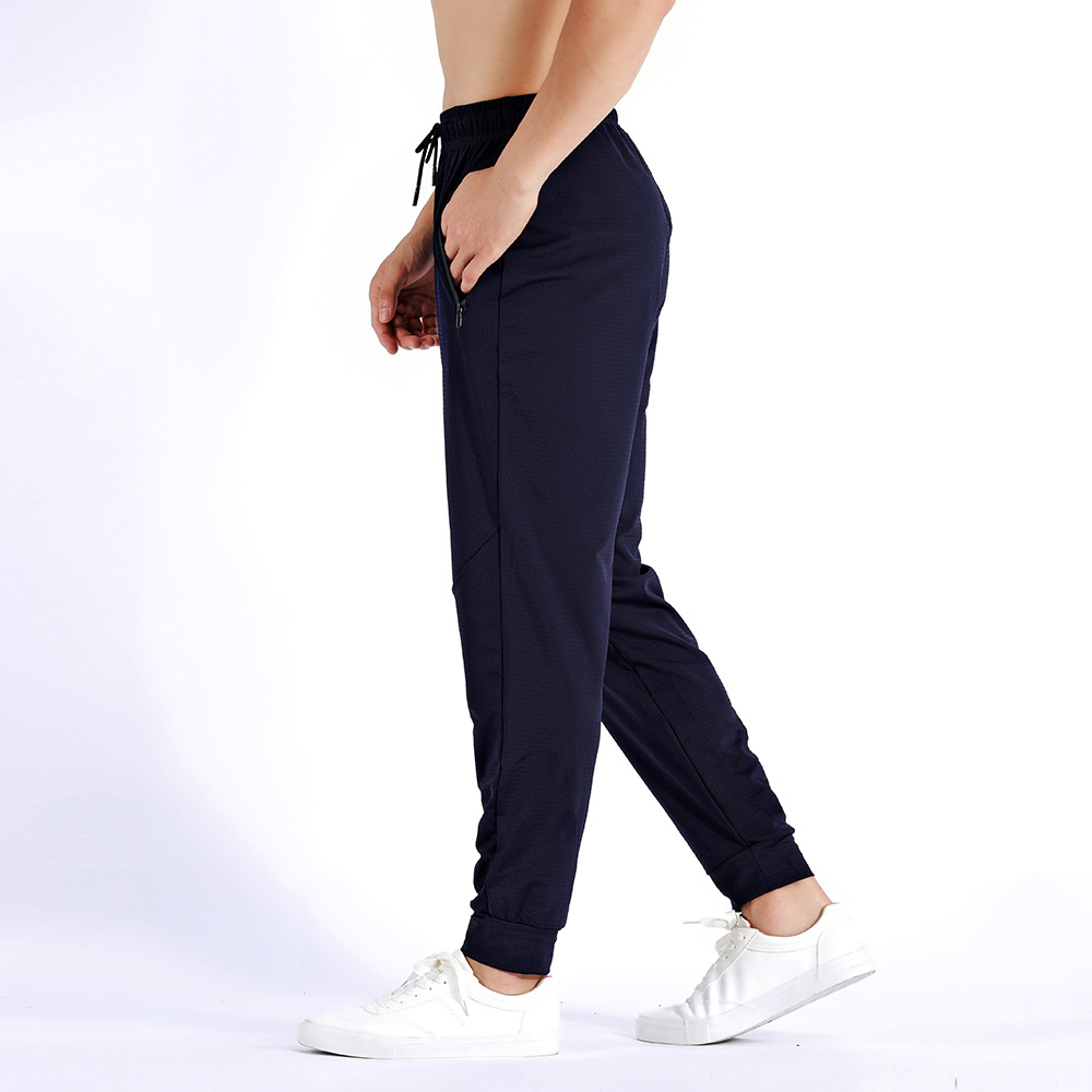 Pantalones deportivos de otoño sueltos más el tamaño de los hombres pantalones elásticos de entrenamiento de secado rápido pantalones ajustados de seda de hielo transpirable en stock