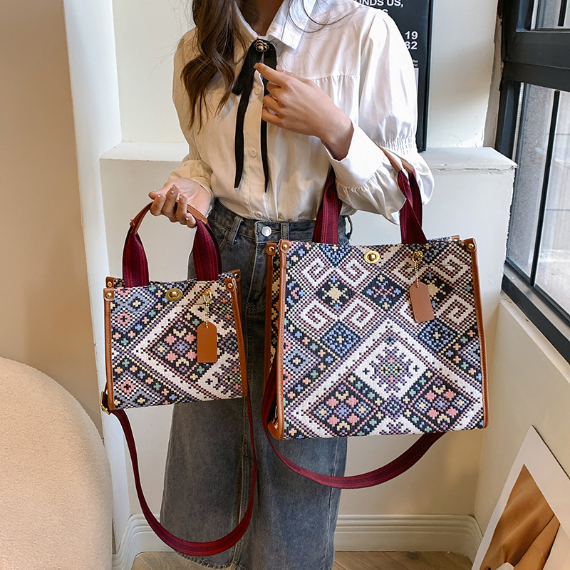 Gran capacidad lona Plaid Portátil Bolsa femenina 2024 transfronteriza primavera nuevo trabajo viajero hombro bolsa de mensajero