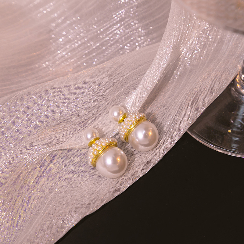 S925 aguja de plata de Corea del Sur de doble cara pendientes de perlas de dos piezas pendientes de diseño de temperamento retro simple de las mujeres