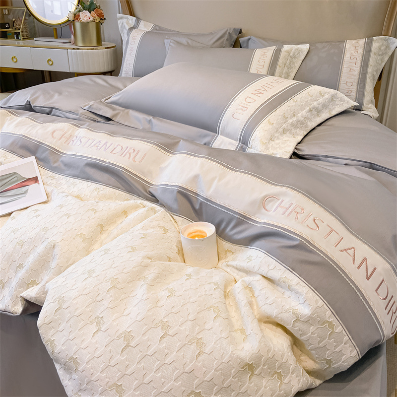 Juego de cuatro piezas de algodón de fibra larga de lujo ligero de cuatro piezas de pata de gallo bordado de algodón puro funda de edredón sábana ropa de cama de alta calidad