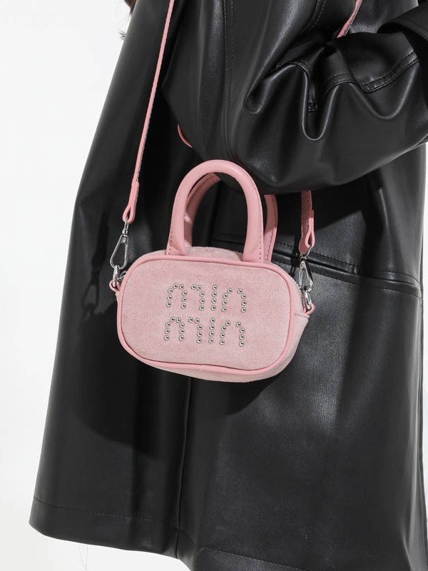 Alta sensación retro de seda mini bolso de mano para mujeres 2025 nuevo alta sensación de humedad de moda mochila
