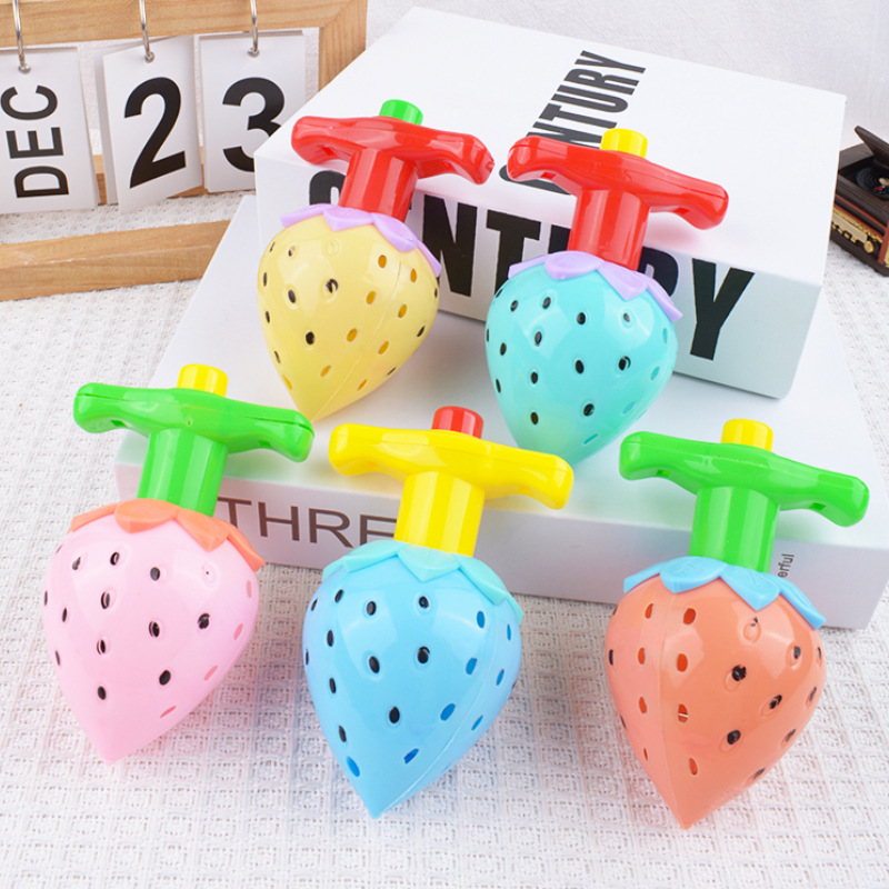 Juguetes de lanzamiento giroscópico luminoso de fresas giratorios de luz brillante para niños y niñas regalos de niños y niñas al por mayor