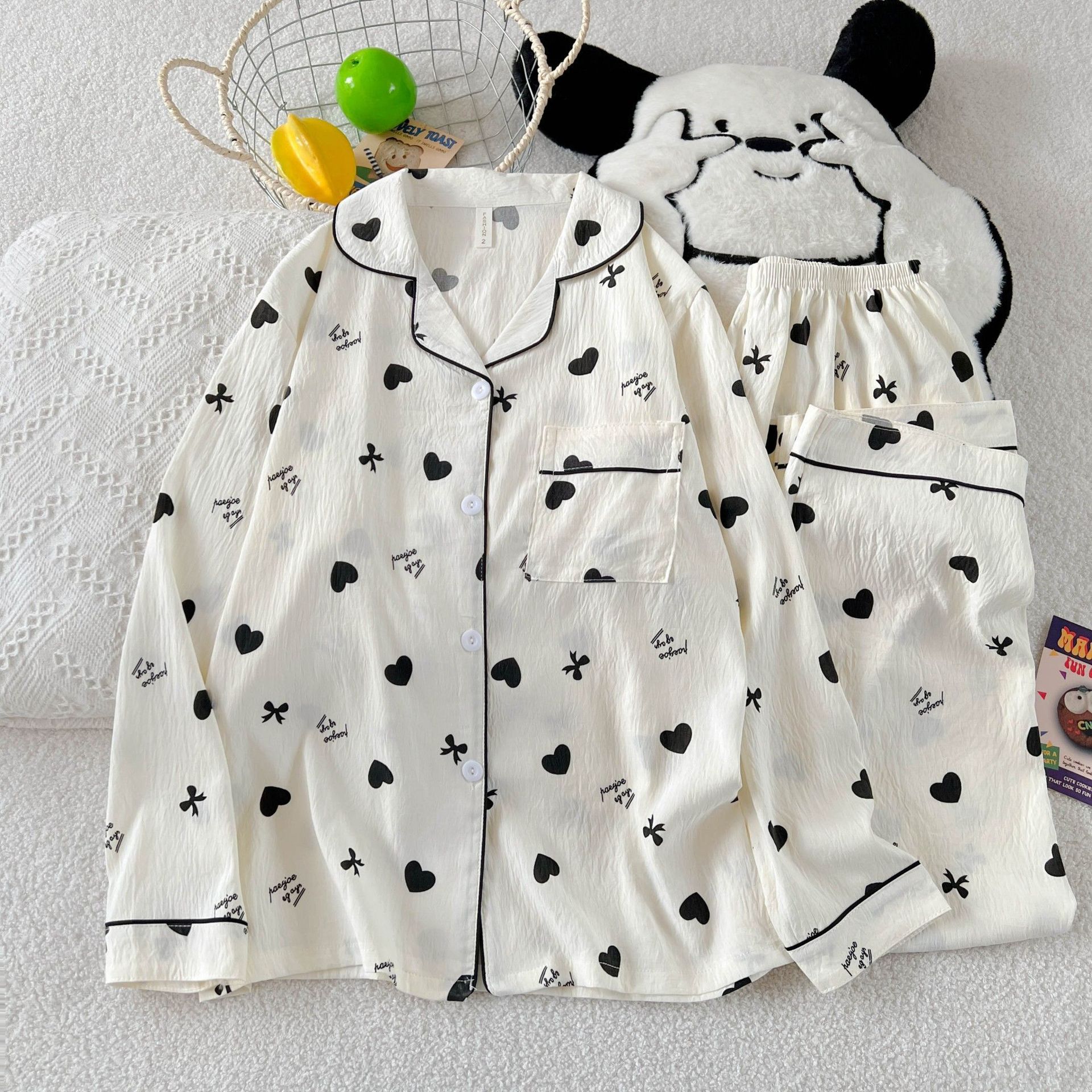 Al por mayor transfronterizo KT gato pijama mujer primavera y otoño nubes algodón manga larga 2026 nuevo juego de ropa de hogar encantadora super caliente