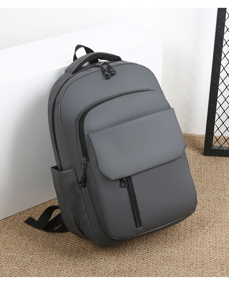 Wholesale of in-stock commuting and business backpacks for men, simple and large-capacity USB charging laptop bags, and student schoolbags undefined
