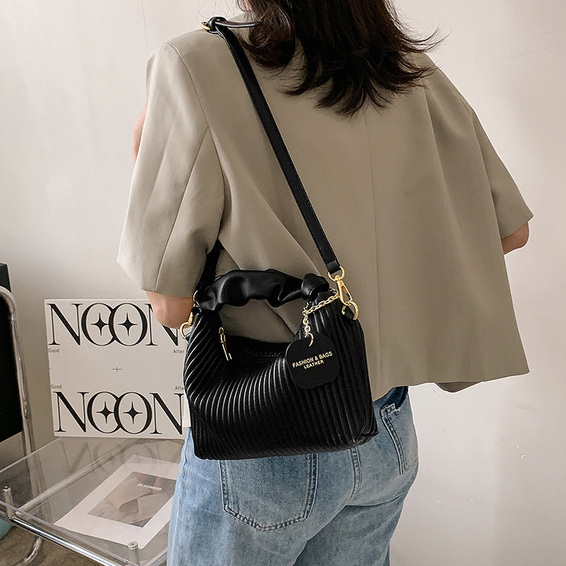 Textured vertical stripe handbag 2024 new niche design single shoulder crossbody bag foreign style versatile bag wholesale for women_voghion.com