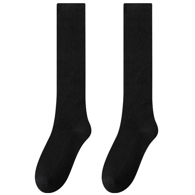 縦条のふくらはぎの靴下の女性の春秋の圧力の長い筒の靴下はやせていることができます。