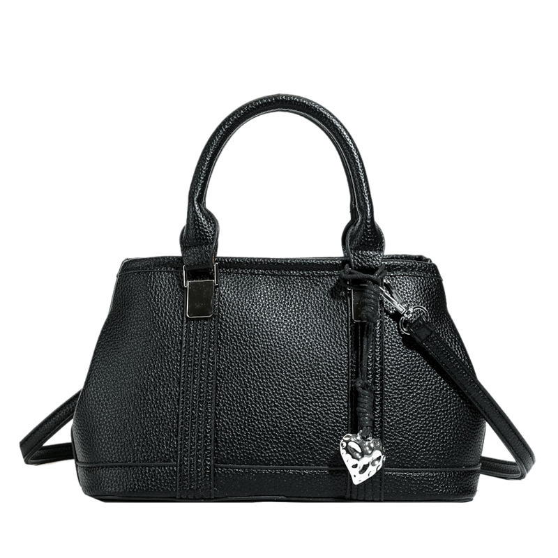 Versión coreana del bolso de nicho 2025 verano nuevo bolso femenino retro patrón de lichi bolso de hombro diario mensajero de viaje