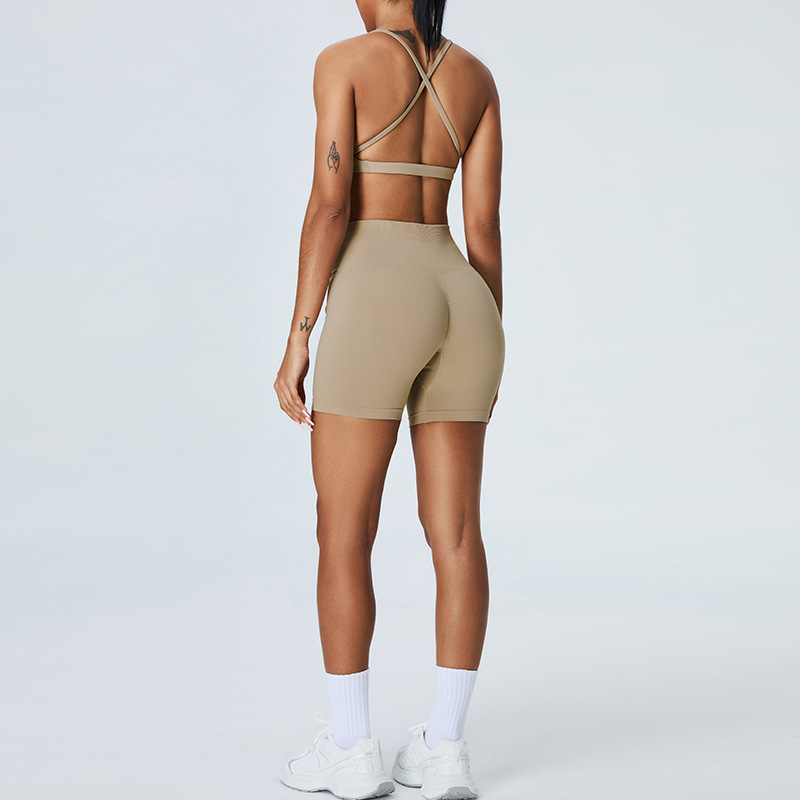 Nuevo traje de yoga sin costuras europeo y americano, pantalones cortos de yoga de cadera de melocotón para mujer, traje deportivo de carrera de espalda cruzada