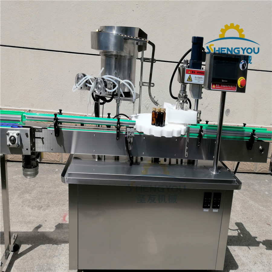 沙棘口服液灌装设备 口服液瓶轧盖机 四头口服液灌装压盖机