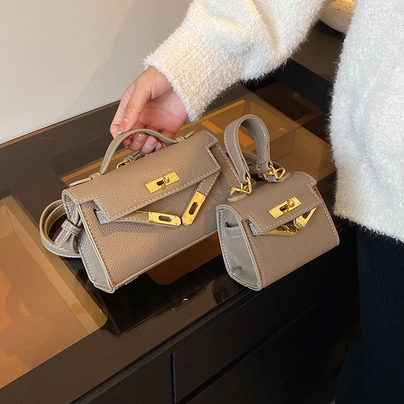 Mini bolso Kelly transfronterizo para niños, bolso de hombro tipo bandolera de un solo hombro con lápiz labial familiar de moda versión coreana de otoño 2023 para mujer