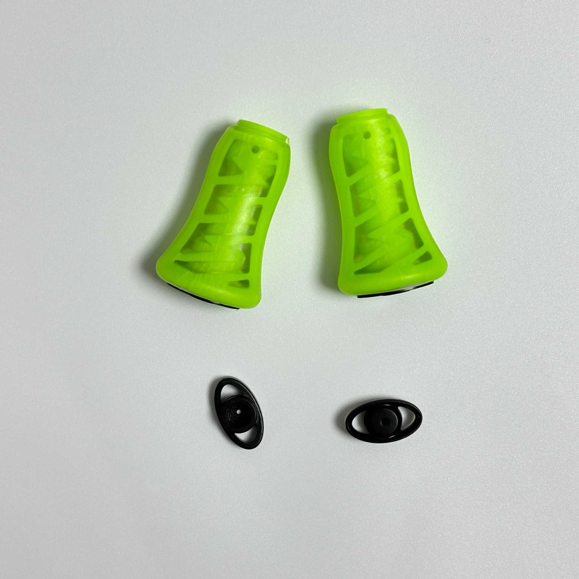 A pair of fluorescent green silicone grip balls