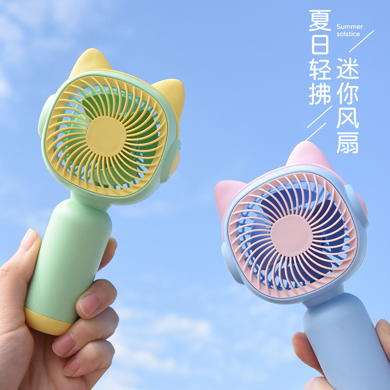 New Style Mini Fan Portable Compact Cartoon Handheld Electric Fan Charging Phone Stand Fan with Custom Manufacturer Logo