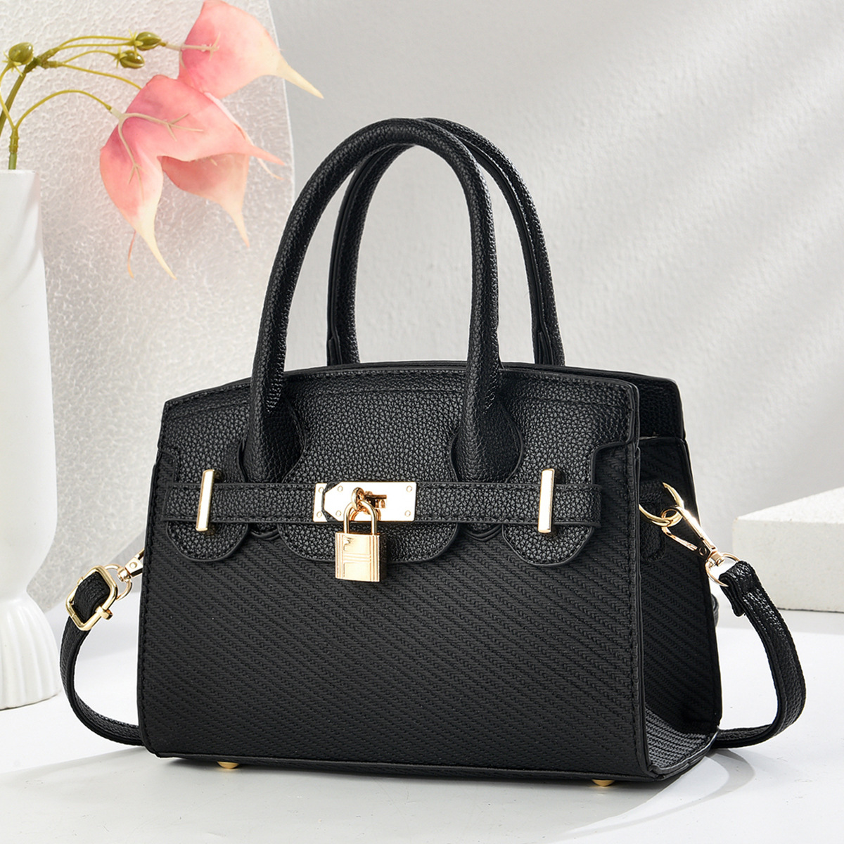 Nuevo modelo de fabricante de patrón de lichi bolso de mensajero de mujer bolso de mensajero 2025 salvaje moda de un solo hombro bolso de madre para mujer portátil