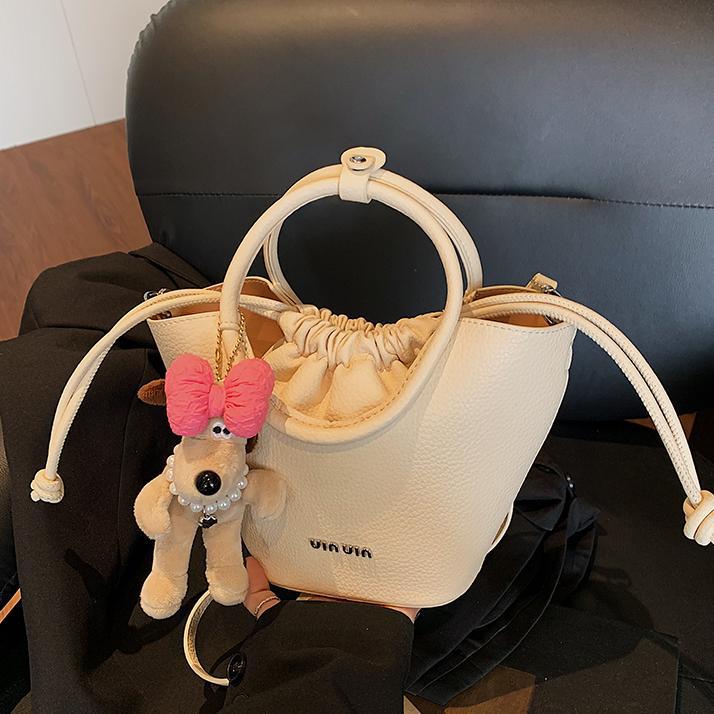 Bolsos de mano de nicho de tendencia transfronteriza para damas 2025 nuevo bolso de hombro simple de moda con textura bolso de cubo de todo fósforo