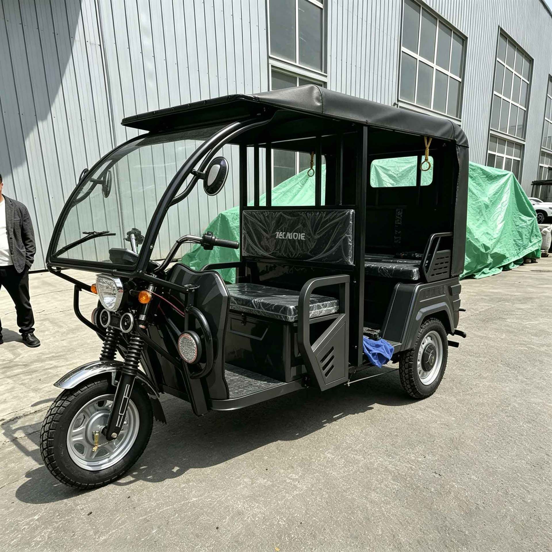 Fueled by a Powerful Engine, the Passenger-Fueled Tricycle with a Canopy Is a Cross-Border Tuktuk for Transporting Passengers and Cargo