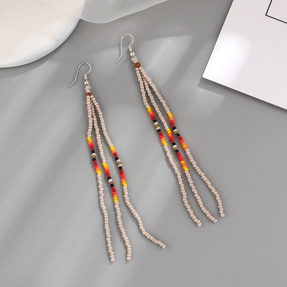 Summer Bohemian handmade tassel rice beads earrings women's long temperament European and American woven earrings earrings wholesale