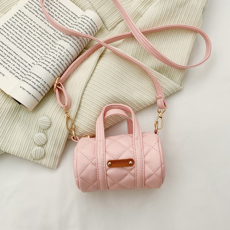 Bolsas infantiles simples de color sólido, bolsas de mini barril de moda coreana, 2025 nuevas bolsas para bebés de comercio exterior