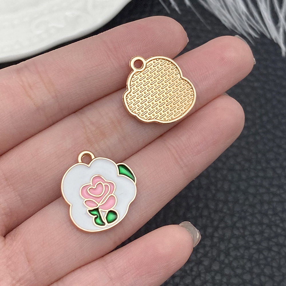 Una marca de rosas blancas con aceite en gotas 18x17mm - 21123 - 1G