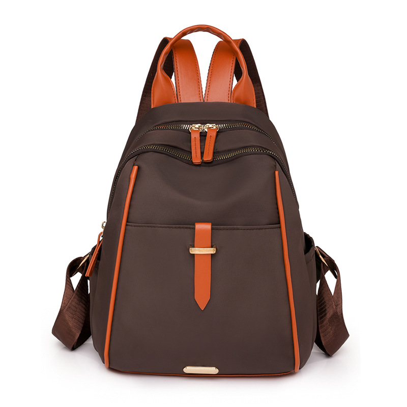 Bolsa de cercanías ligera para mujer 2024 nueva mochila de color de contraste de moda de gran capacidad para estudiantes mochila de nailon al por mayor