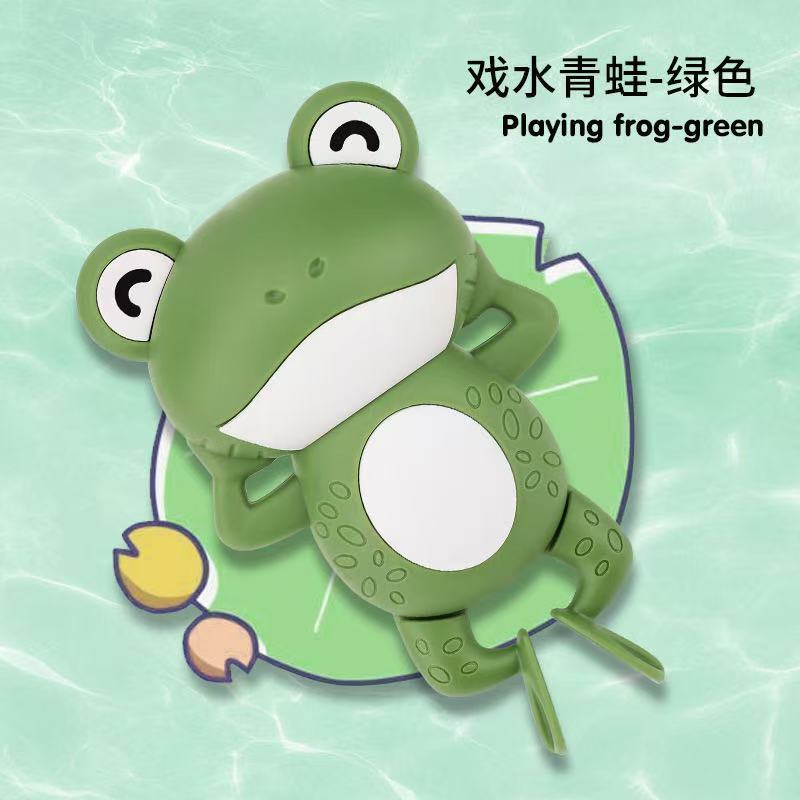 Green frog playing in water