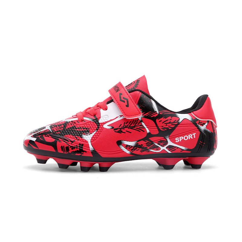 Nuevo transfronterizo niños y niñas transpirables cómodos deportes ociosos bajos clavos largos competencia de césped fabricantes de zapatos de fútbol de estudiantes