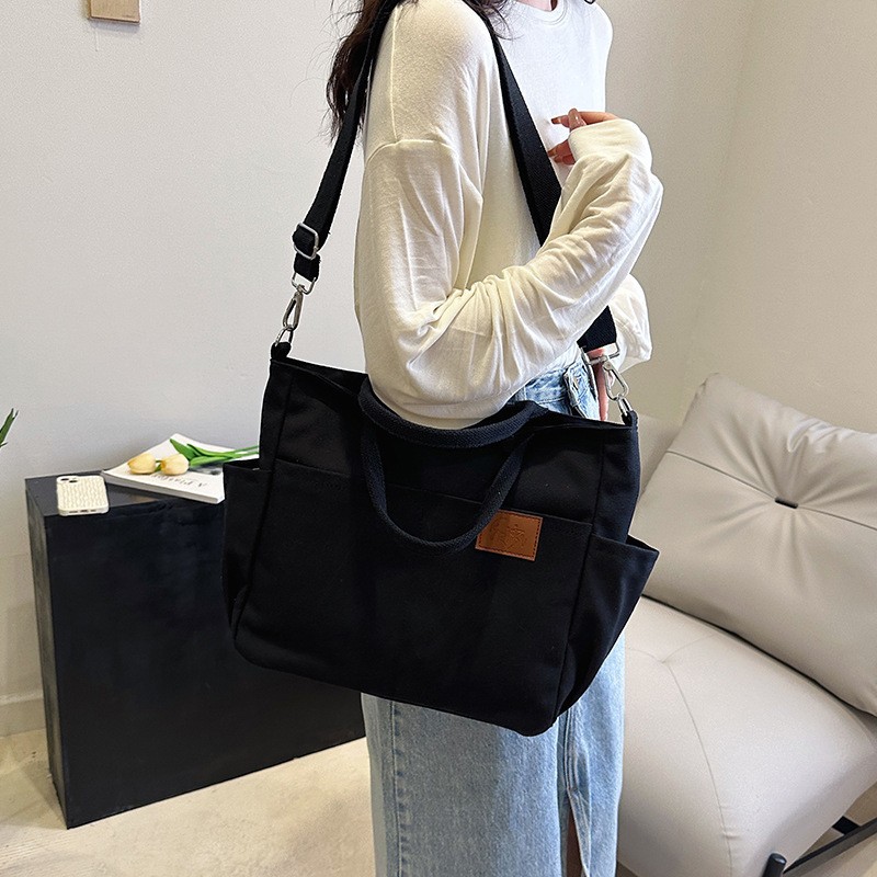 Bolso de lona con diseño de nicho, nuevo bolso tote de gran capacidad, bolso de hombro versátil para ir al trabajo, bolso informal para mujer