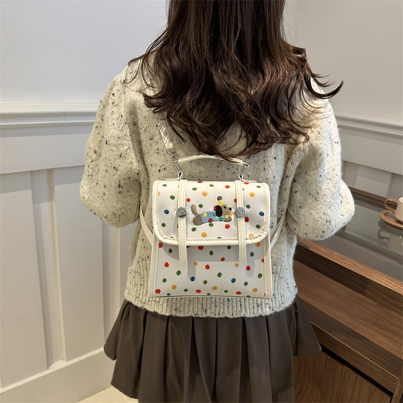 Cute bolso de mujer de dibujos animados 2024 nuevo estilo versátil texturas de estilo de viaje simple mochila de estilo universitario