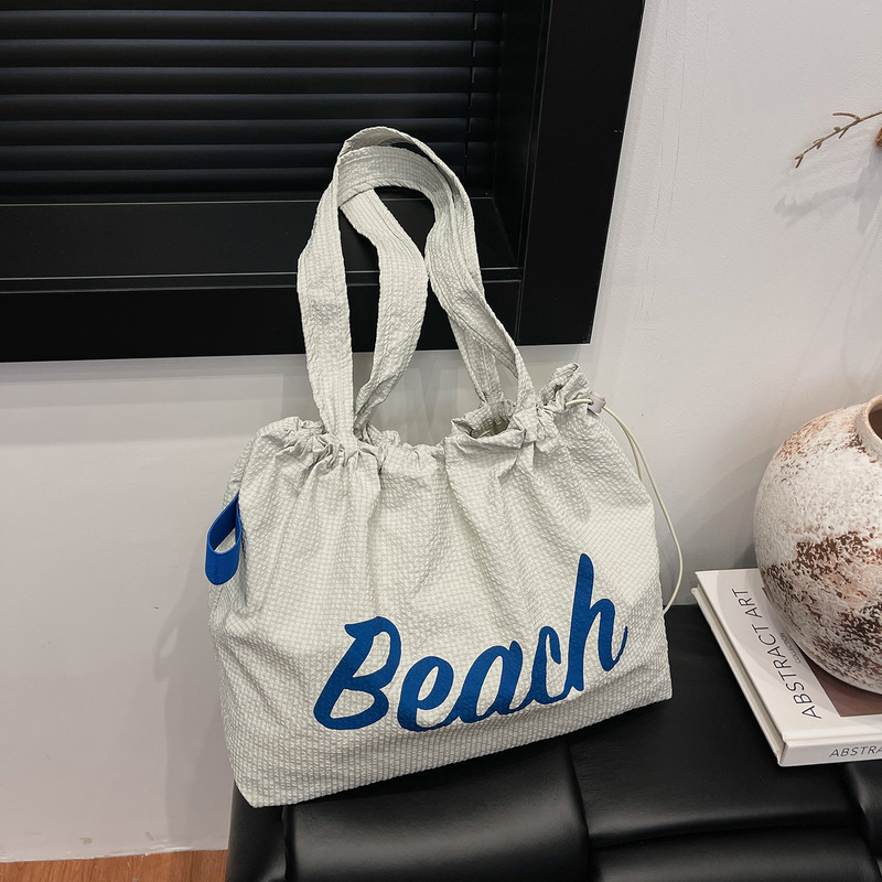 韓国版の新しいレタープリントカジュアル大容量トートバッグ軽量旅行多用途レイジースタイル巾着ショルダーバッグ|undefined