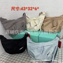 日系简约大容量斜挎包女2025新款学生小挎包单肩布包百搭饺子包女