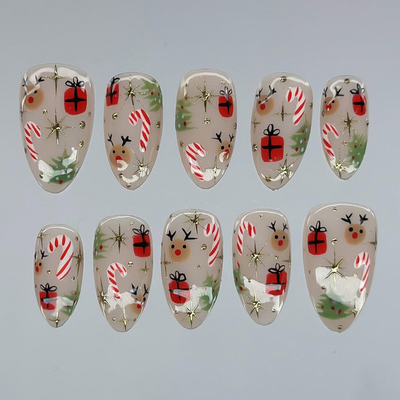 30 pieces of cartoon-style Christmas nail art, featuring hand-painted reindeer, candy cane, Christmas tree, and gold star embellishments, in nude color 30 pieces of cartoon-style Christmas nail art, featuring hand-painted reindeer, candy cane, Christmas tree, and gold star embellishments, in nude color