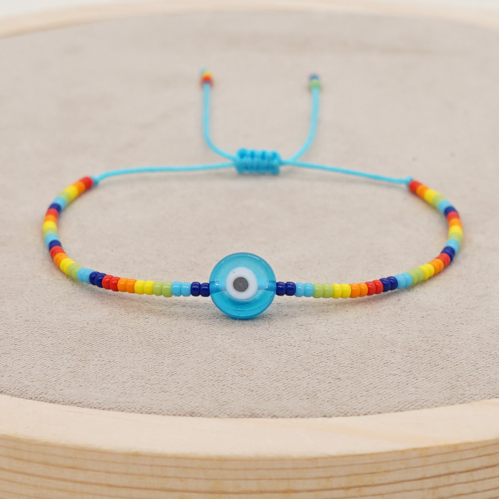 Bohemian style simple Glazed Devilu0027s Eyes Rainbow Blue and White Rice Beads Bracelet
