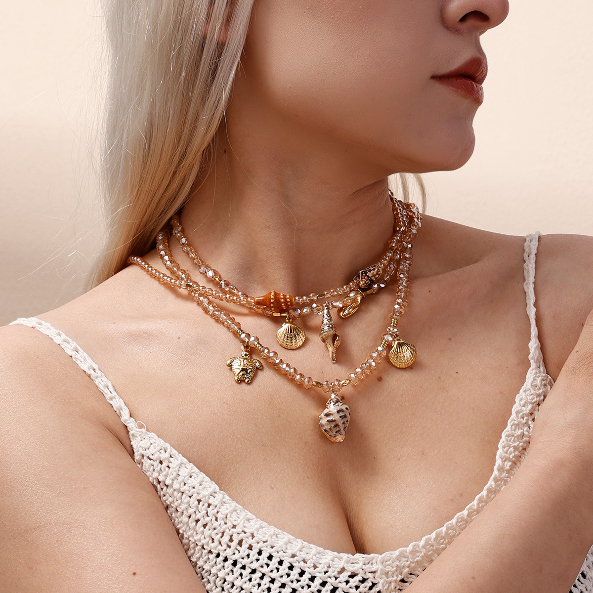 Taina colgante de acero inoxidable europeo y americano 18k collar de cuentas de cerámica de concha de caracol dorado dulce y fresco chica caliente viento ins transfronterizo