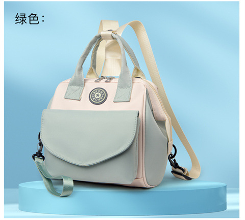 The Mommy bag is small and cute. It has a detachable front pocket and is a multi-functional baby bag. It is waterproof, lightweight, and has a crossbody design. It can be used to carry milk bags undefined