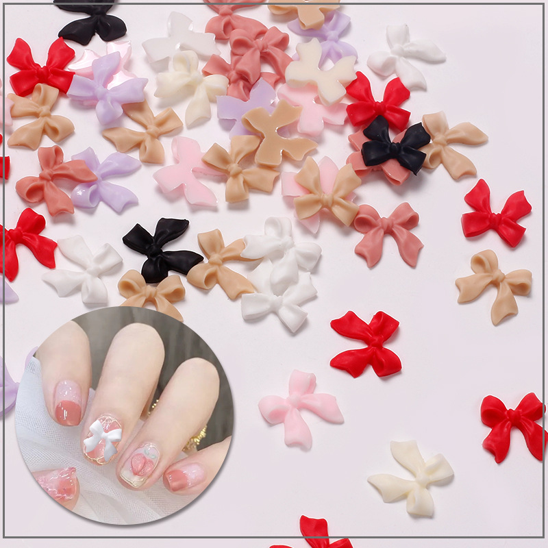 Joyas de arco de uñas al por mayor en línea explosión simple de resina joyas de uñas estereoscópicas flotantes mezcladas 50