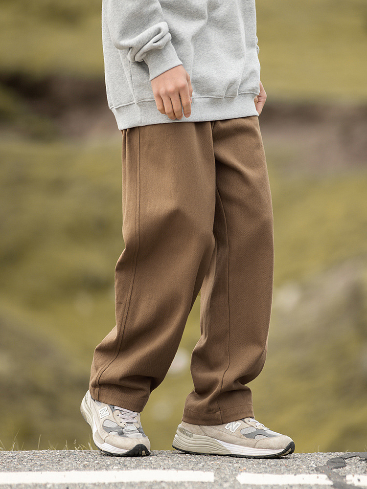 Pantalones casuales sueltos rectos de microperfil para hombre 2025 primavera nuevo estilo montaña pantalones retro de sarga de textura de algodón puro de todo fósforo