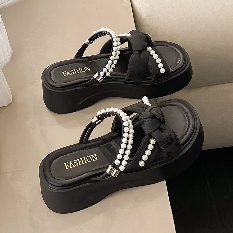Zapatillas de estilo nacional de perlas para mujeres de verano 2026 nuevo estilo de hadas con falda no cansarse pies zapatillas frías damas