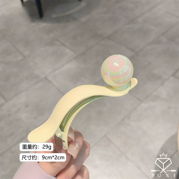 Beige hairgrip from pearl, simple and elegant design