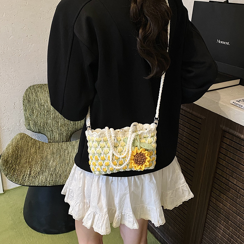 Nuevo paquete infantil transfronterizo ganchillo hecho a mano flores dulces bolsas de hombro para hombres y mujeres viajes de vacaciones bolsas de cestas de verduras portátiles